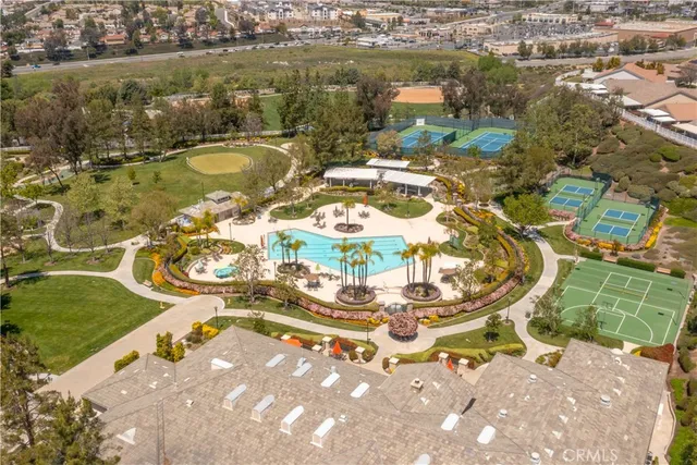 an aerial view of multiple houses with yard