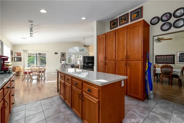a kitchen with a sink refrigerator and cabinets