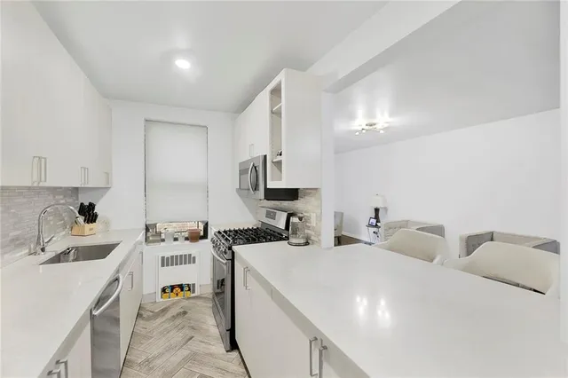 a room with two washing machine and sink