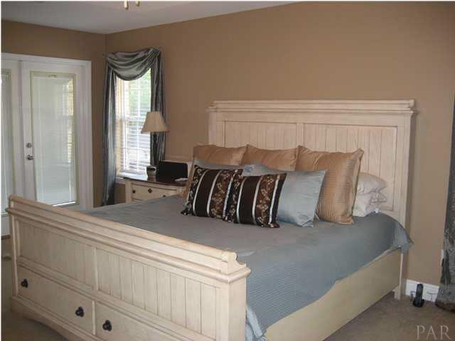2660 Wallace Lake Road Pace, FL 32571 - Photo 23 of 25 Master Bedroom with doors leading out to Pool area