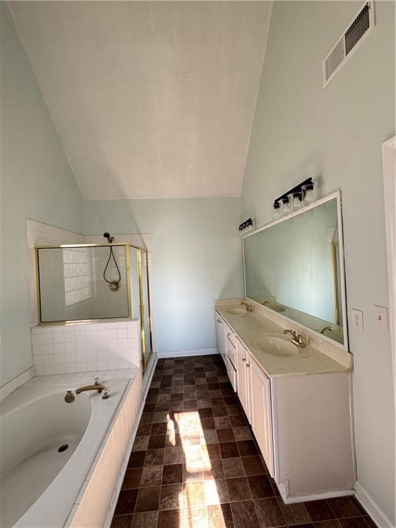 1009 Chads Ridge Jonesboro, GA 30236 - Photo 16 of 28 a bathroom with a tub sink and mirror