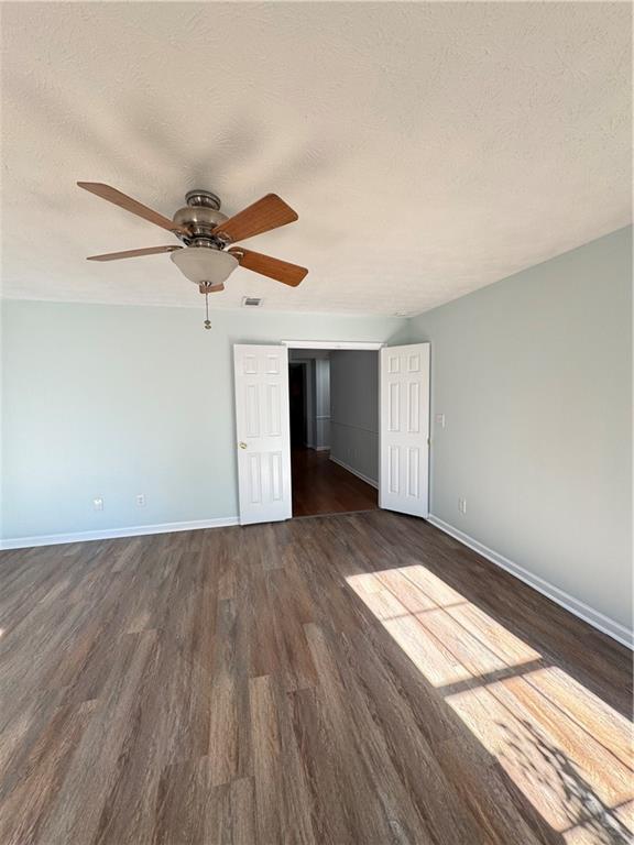 1009 Chads Ridge Jonesboro, GA 30236 - Photo 17 of 28 an empty room with wooden floor and windows