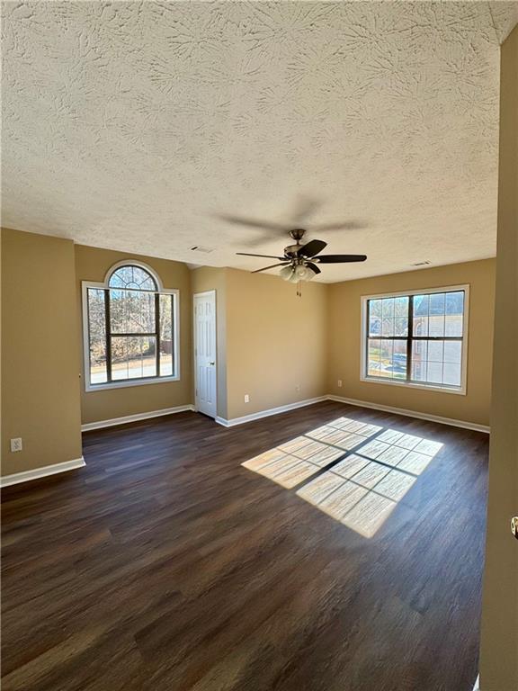 1009 Chads Ridge Jonesboro, GA 30236 - Photo 23 of 28 an empty room with wooden floor and windows