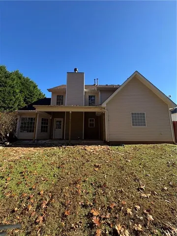 a house with trees in the background
