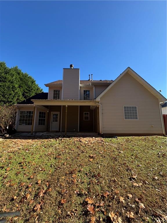 1009 Chads Ridge Jonesboro, GA 30236 - Photo 27 of 28 a house with trees in the background