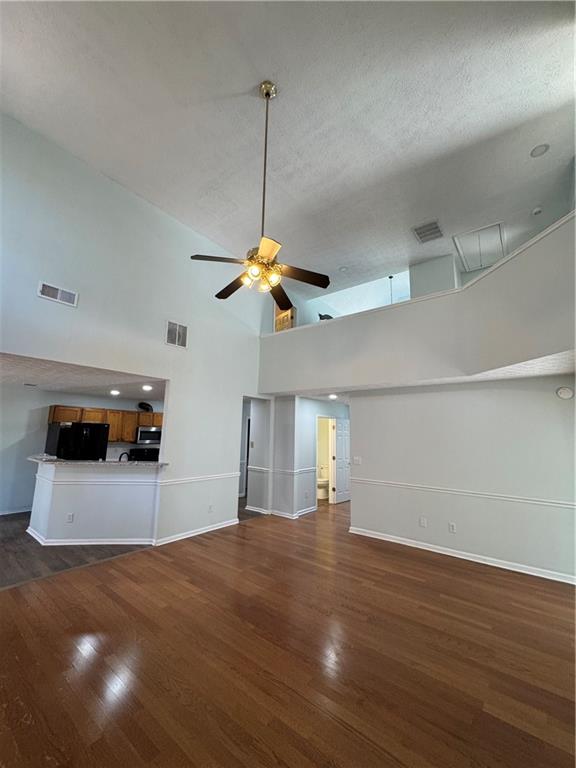 1009 Chads Ridge Jonesboro, GA 30236 - Photo 7 of 28 a room with lots of chandelier and wooden floor