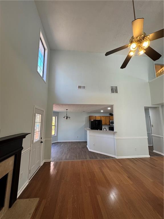 1009 Chads Ridge Jonesboro, GA 30236 - Photo 8 of 28 a view of a kitchen with a sink and dishwasher wooden floor