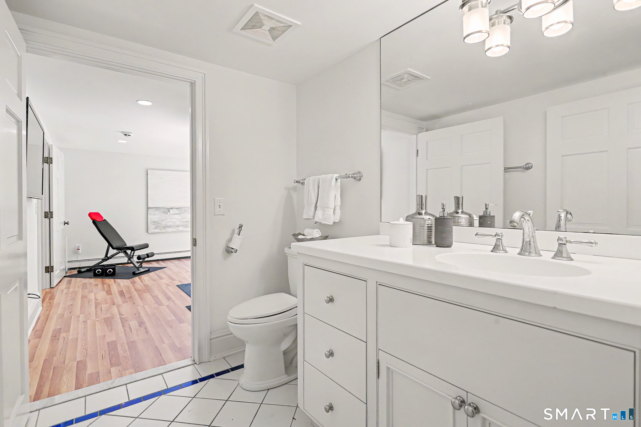 6 Adams Way Weston, CT 06883 - Photo 29 of 40 The ensuite full bathroom for the 5th bedroom is also accessible from the gym.