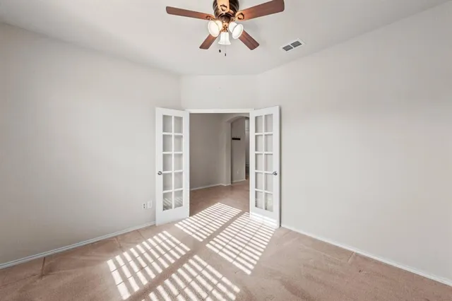 a view of an empty room and window