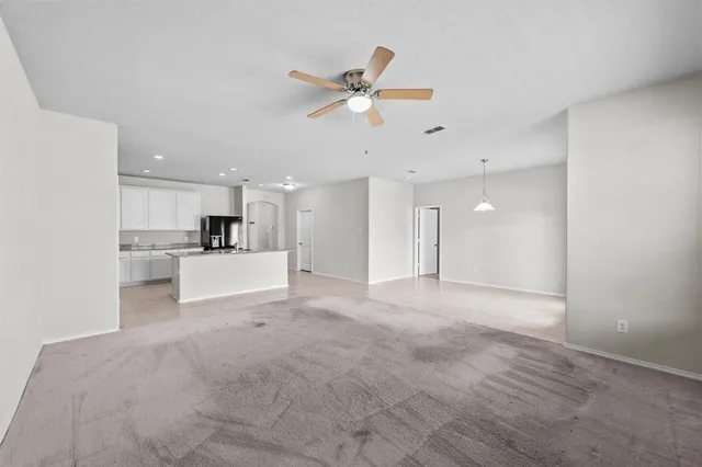 a view of a kitchen with a sink and cabinets
