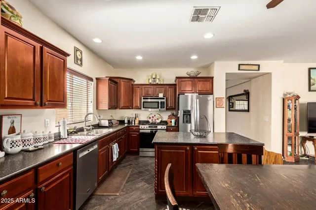 a kitchen with granite countertop lots of counter top space