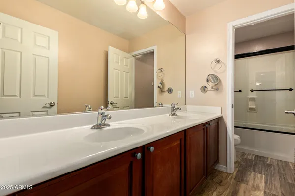 a bathroom with a double vanity sink mirror and double