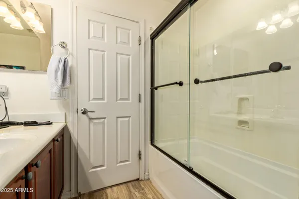 a utility room with cabinets washer and dryer