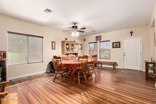 a view of a dining room with furniture and wooden floor