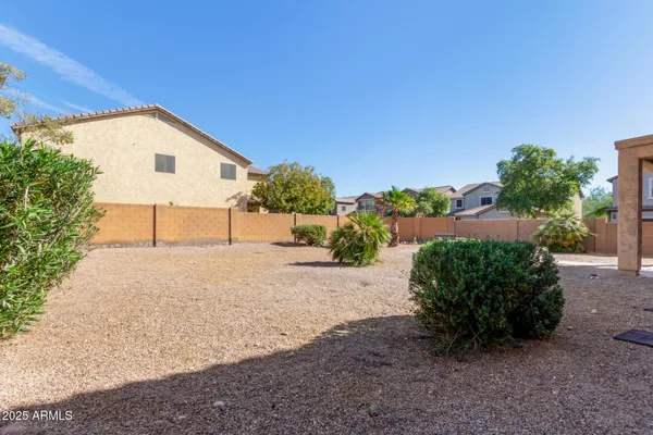 a front view of a house with a yard and a garage