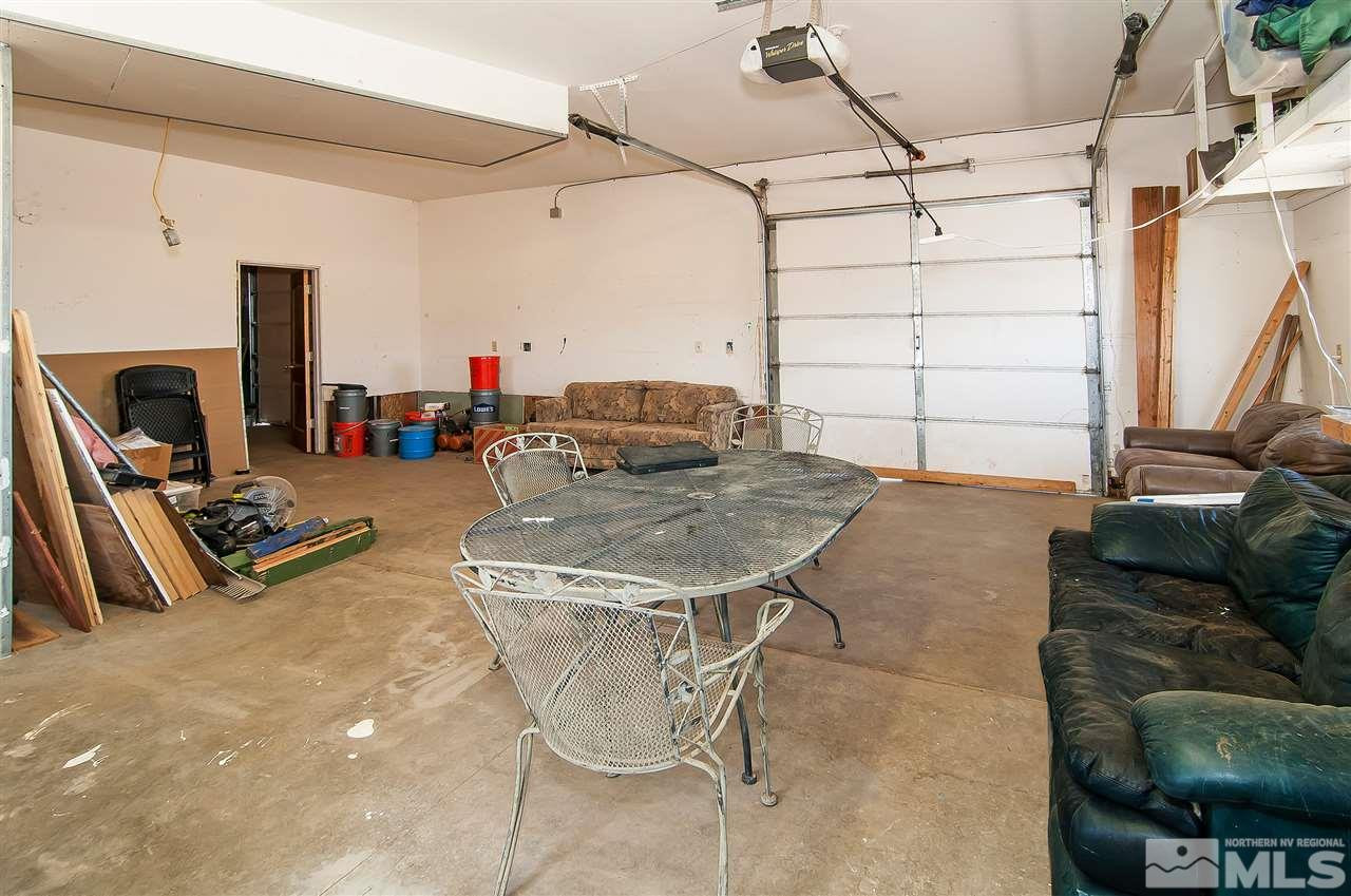 90 Bobcat Hill Road Reno, NV 89508 - Photo 16 of 24 a living room with furniture a flat screen tv and a table