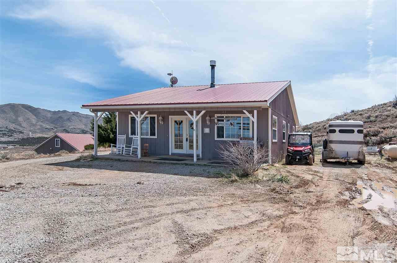 90 Bobcat Hill Road Reno, NV 89508 - Photo 2 of 24 a front view of a house with a yard