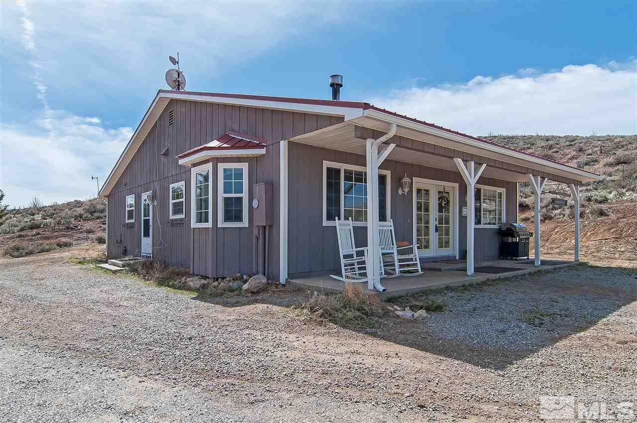90 Bobcat Hill Road Reno, NV 89508 - Photo 4 of 24 a front view of a house with a garden