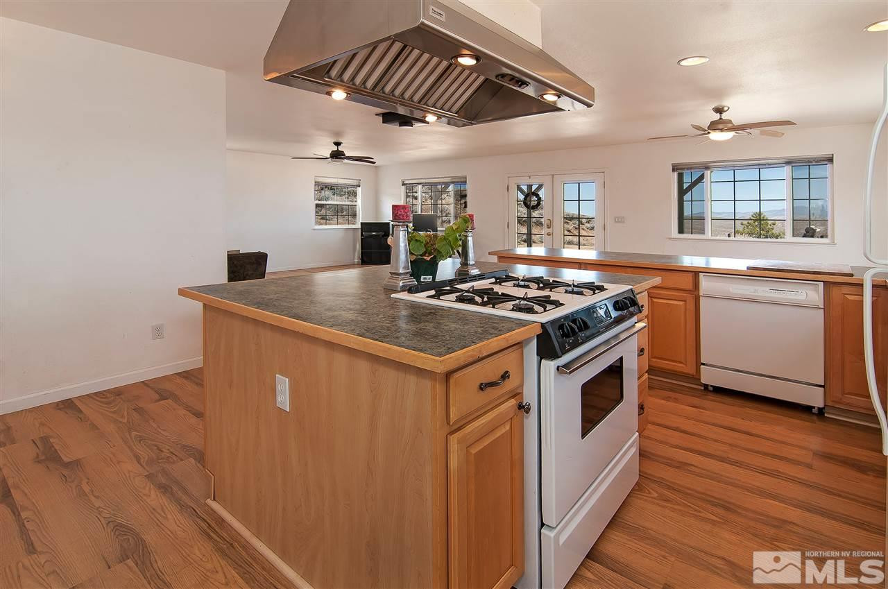 90 Bobcat Hill Road Reno, NV 89508 - Photo 10 of 24 a kitchen with stainless steel appliances granite countertop a stove a sink and a refrigerator