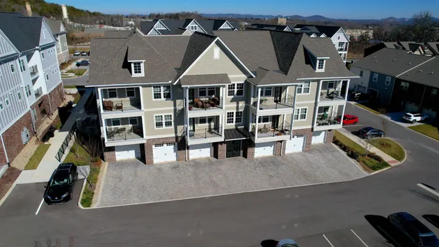 an aerial view of a house with a lake view