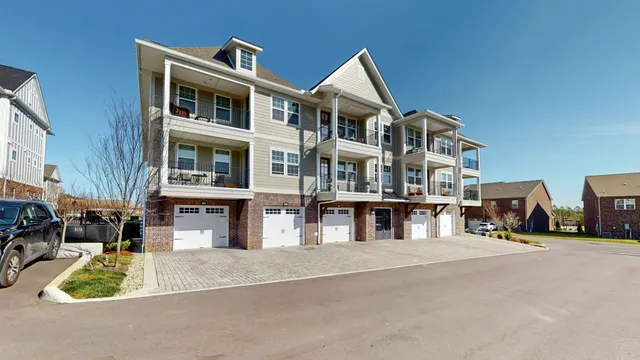 a view of multiple houses with a street