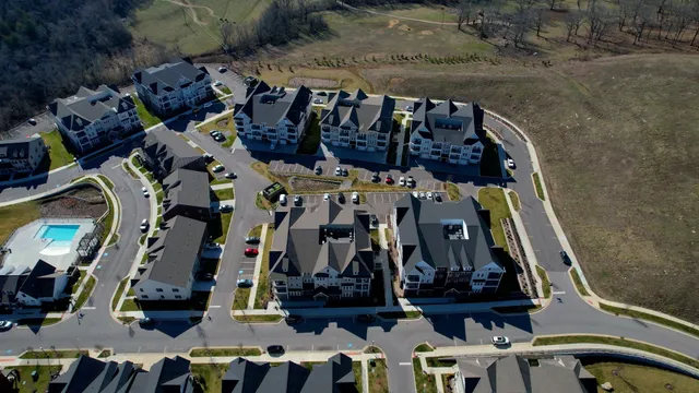 an aerial view of a house with a swimming pool