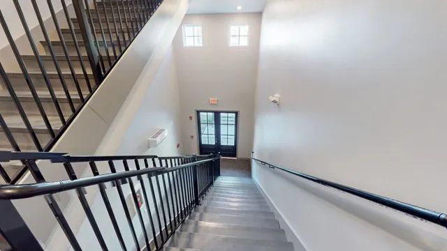 a view of a brick house with outdoor seating area