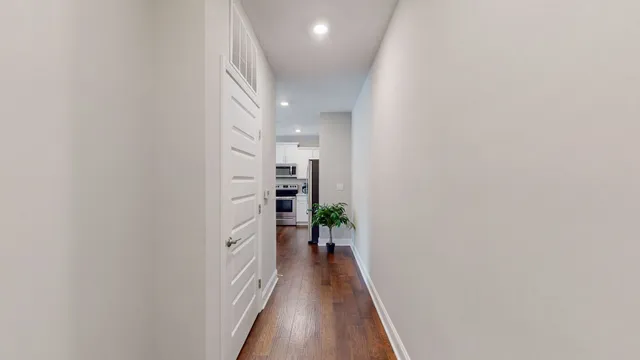 a large kitchen with kitchen island a sink stainless steel appliances and cabinets