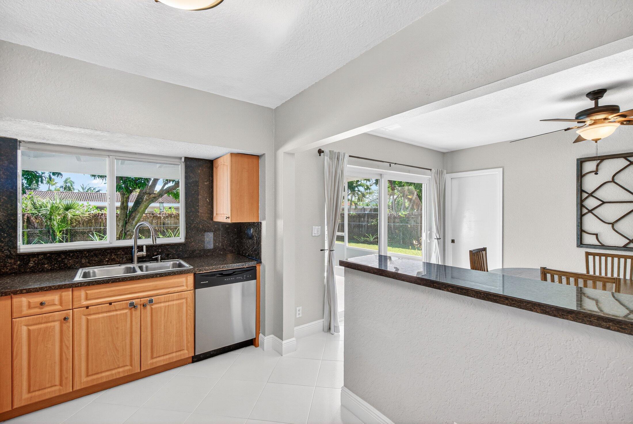 1200 Southwest 12th Terrace Boca Raton, FL 33486 - Photo 14 of 29 Kitchewn facing sliding doors to patio