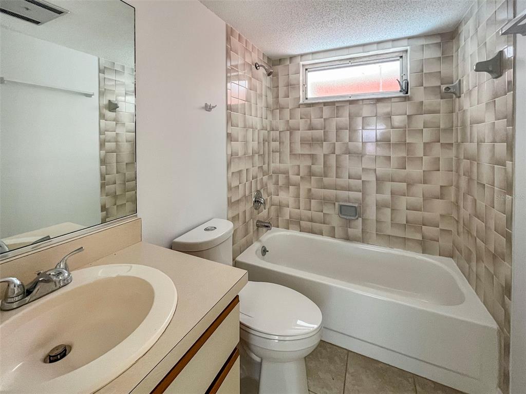 3957 Proctor Road Sarasota, FL 34233 - Photo 12 of 18 a bathroom with a sink toilet and shower