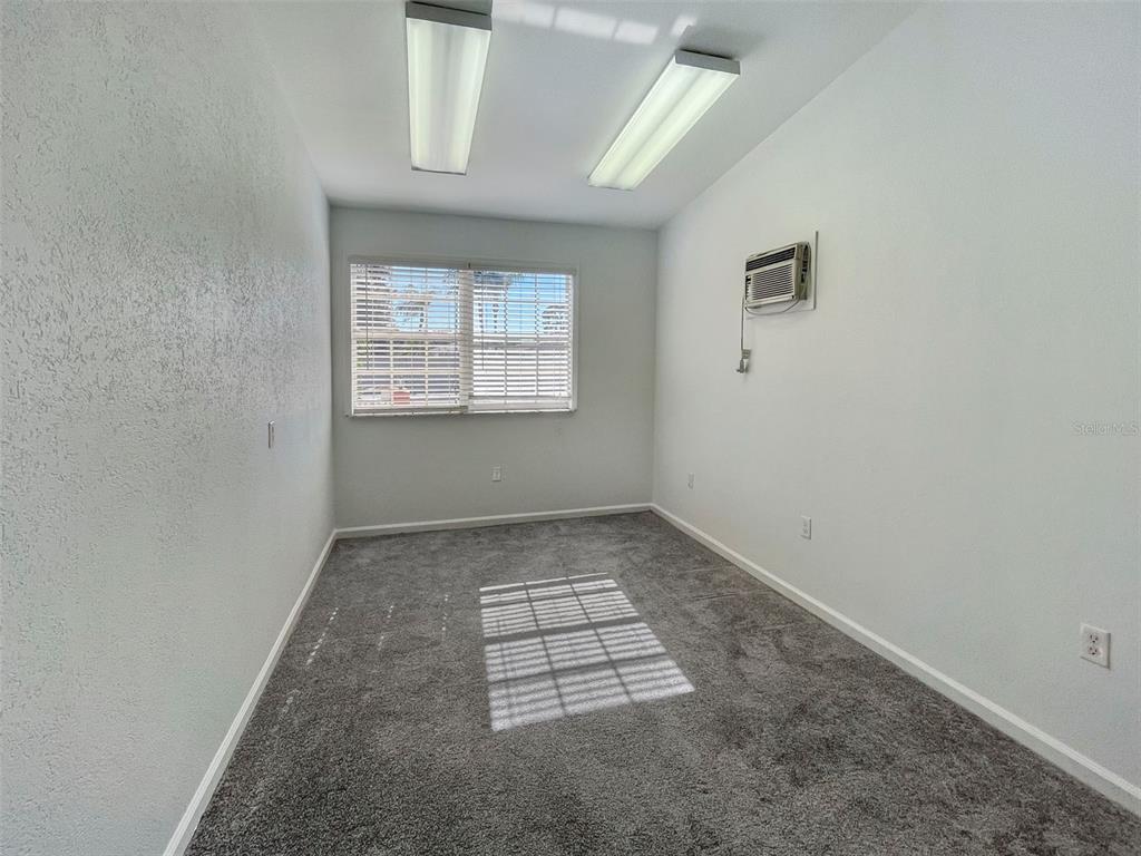 3957 Proctor Road Sarasota, FL 34233 - Photo 13 of 18 an empty room with windows