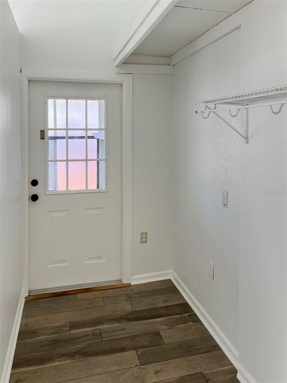 3957 Proctor Road Sarasota, FL 34233 - Photo 16 of 18 a view of a room with wooden floor and cabinet