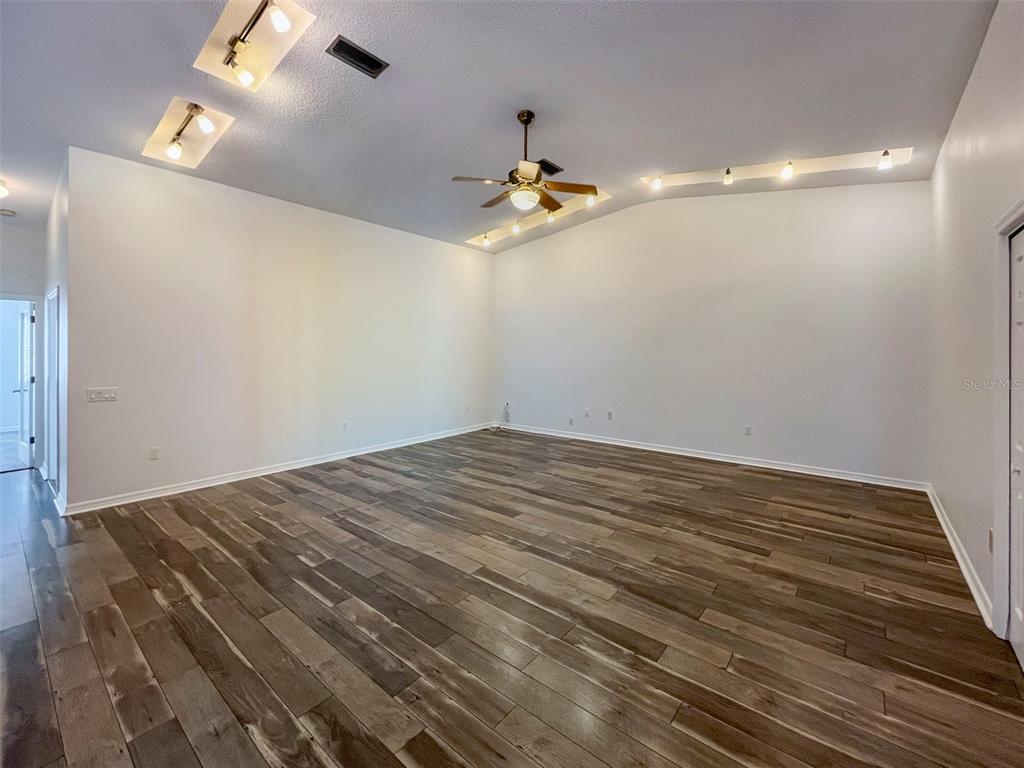3957 Proctor Road Sarasota, FL 34233 - Photo 4 of 18 wooden floor in an empty room