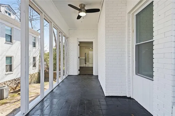 a view of a hallway with a glass door