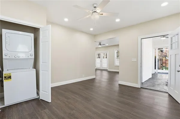 a view of a hallway with wooden floor