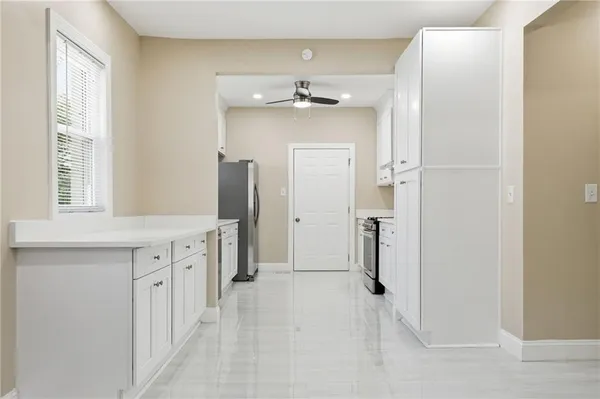 a bathroom with a double vanity sink mirror and shower