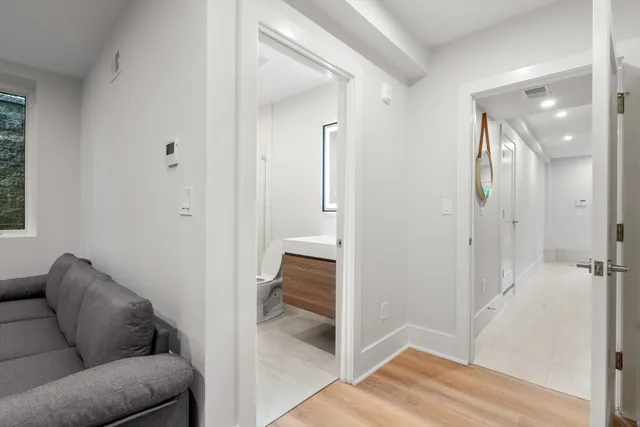 a living room with furniture and a walk in closet