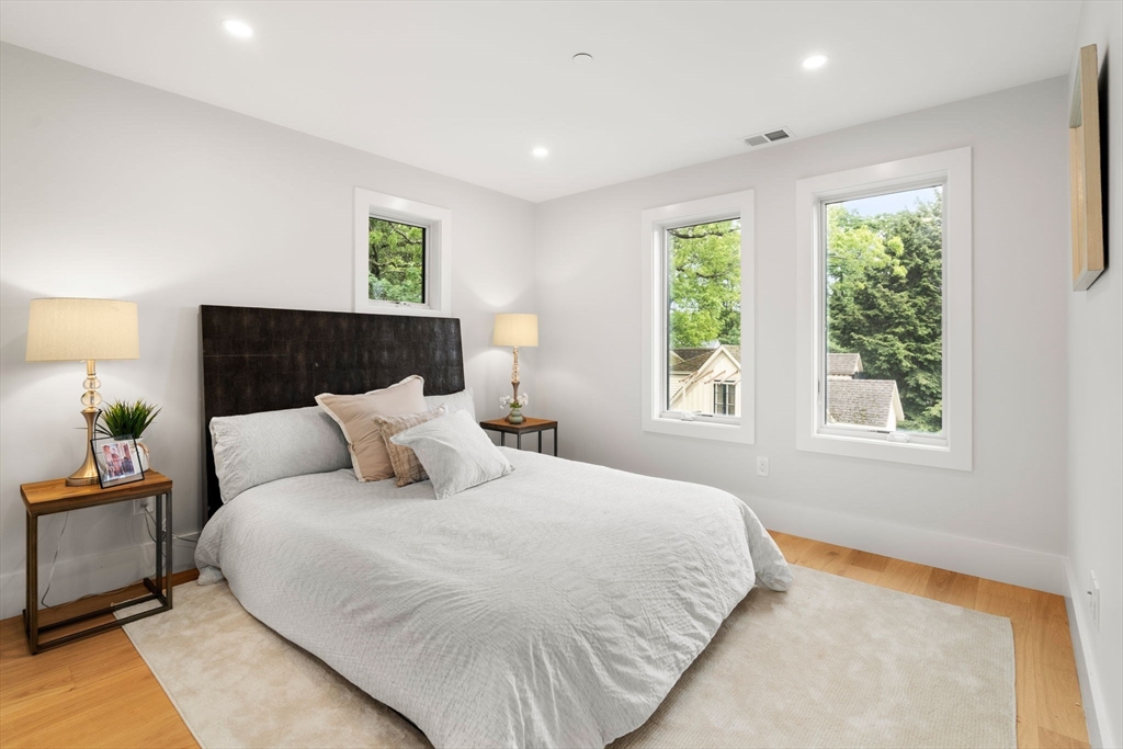 2202 Commonwealth Avenue, Unit 2 Newton, MA 02466 - Photo 13 of 23 a bedroom with a bed and a window