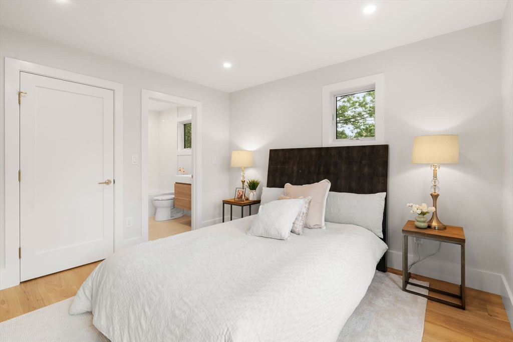 2202 Commonwealth Avenue, Unit 2 Newton, MA 02466 - Photo 14 of 23 a bedroom with a bed and a night stand