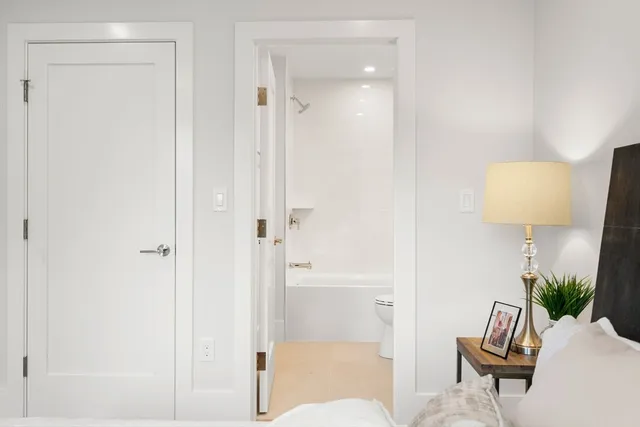 a living room with furniture and a lamp