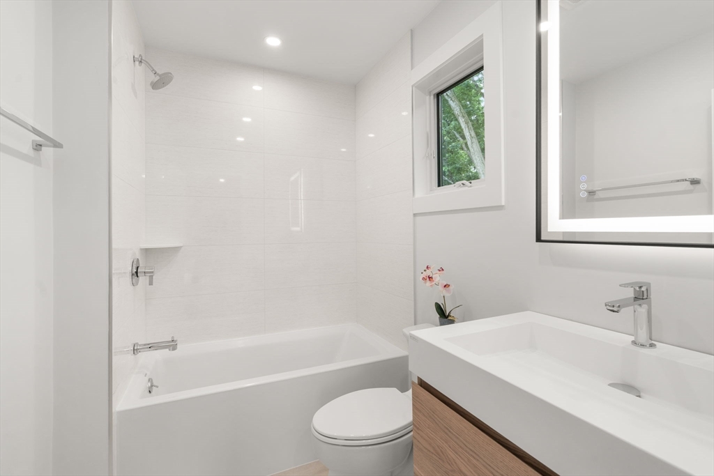 2202 Commonwealth Avenue, Unit 2 Newton, MA 02466 - Photo 16 of 23 a bathroom with a sink toilet and shower