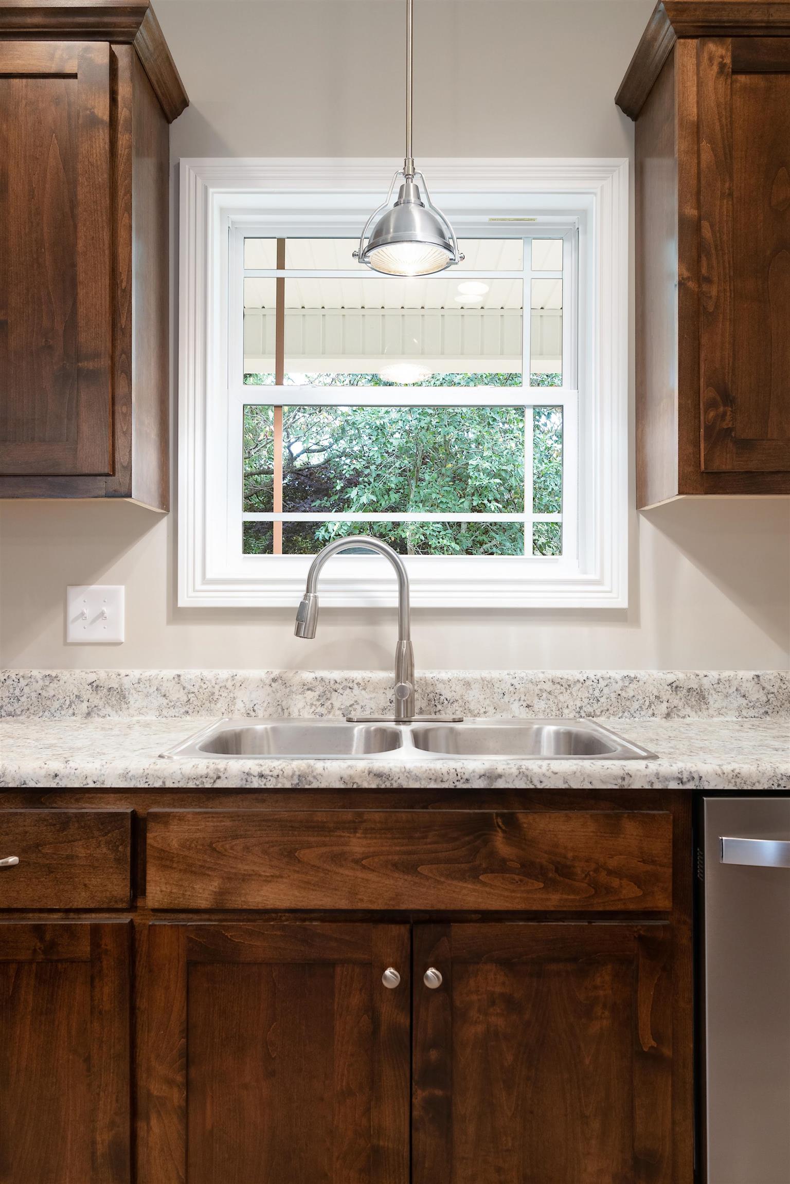 4760 Somerville Road Cross Plains, TN 37049 - Photo 13 of 30 a kitchen with granite countertop a sink and a window