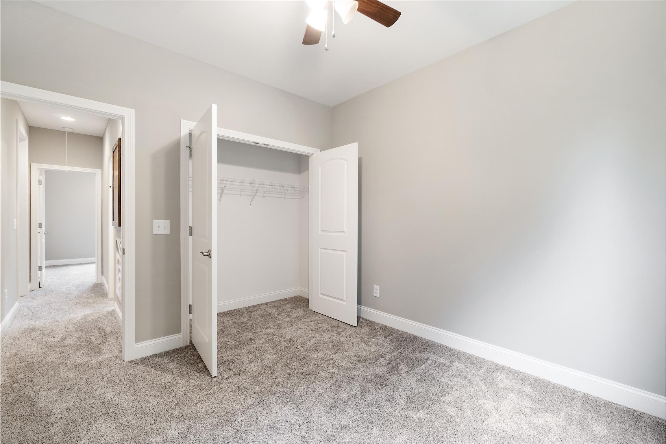 4760 Somerville Road Cross Plains, TN 37049 - Photo 19 of 30 an empty room with fan and entrance