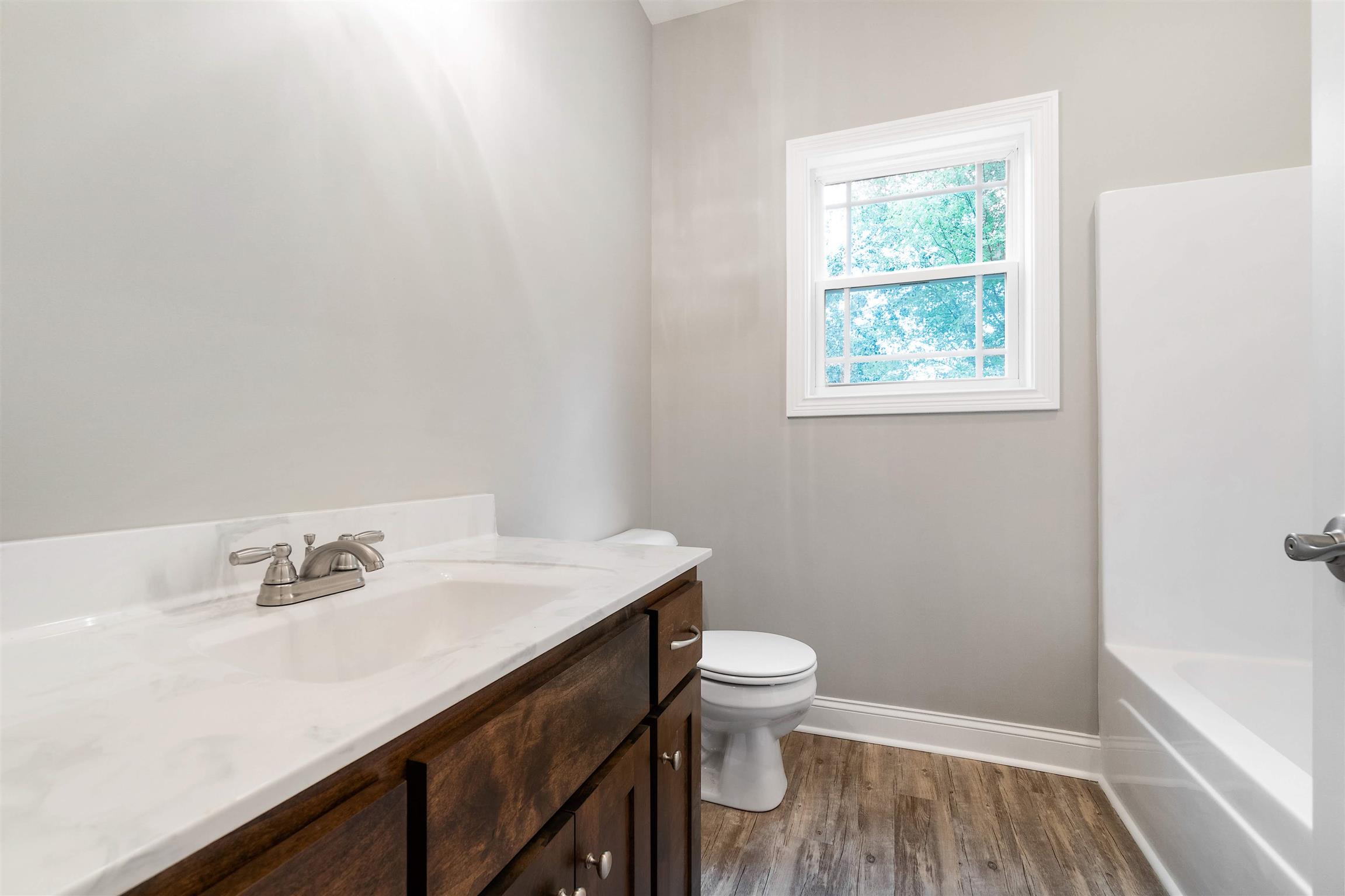 4760 Somerville Road Cross Plains, TN 37049 - Photo 20 of 30 a bathroom with a sink toilet and vanity