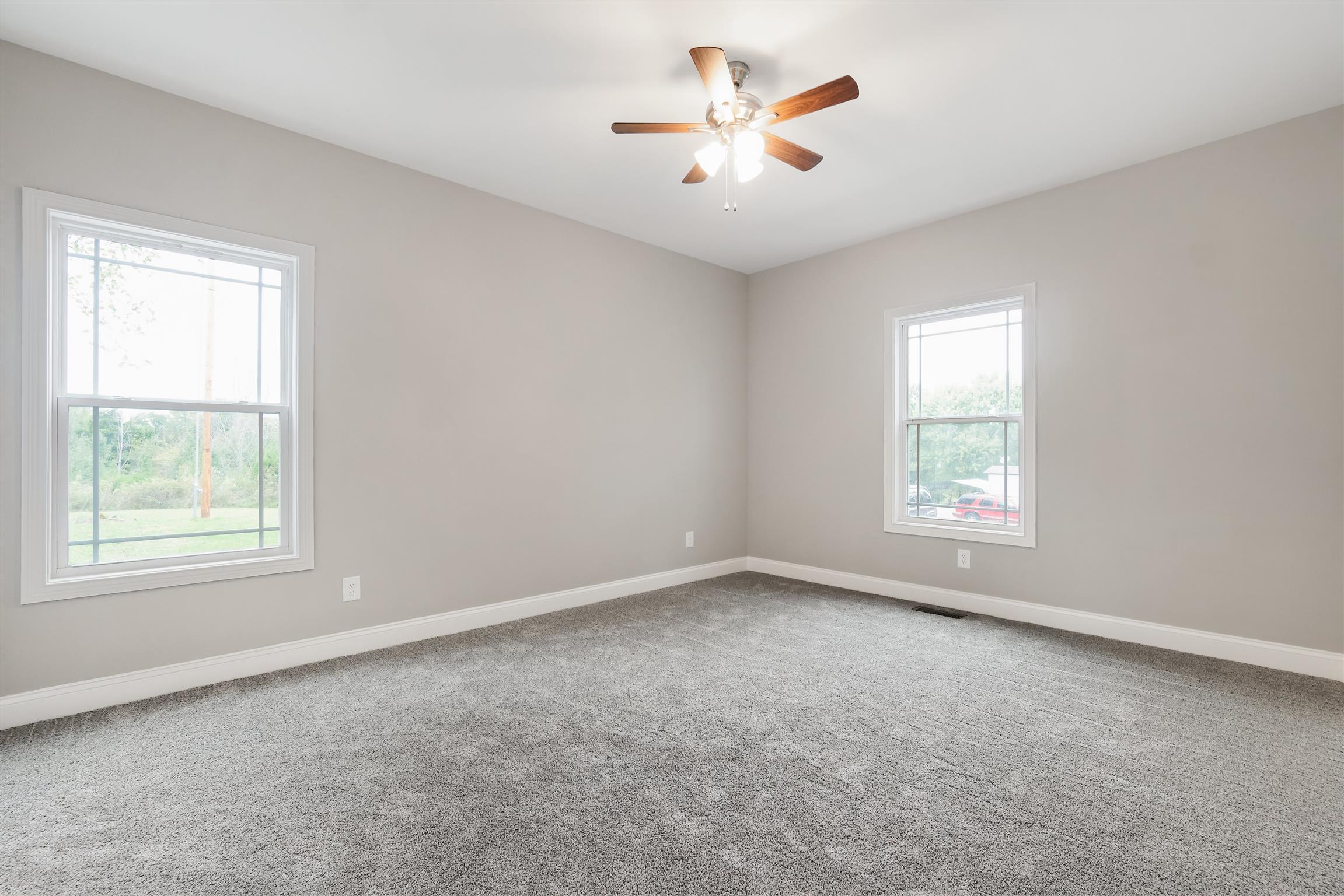 4760 Somerville Road Cross Plains, TN 37049 - Photo 23 of 30 an empty room with a window and a fan