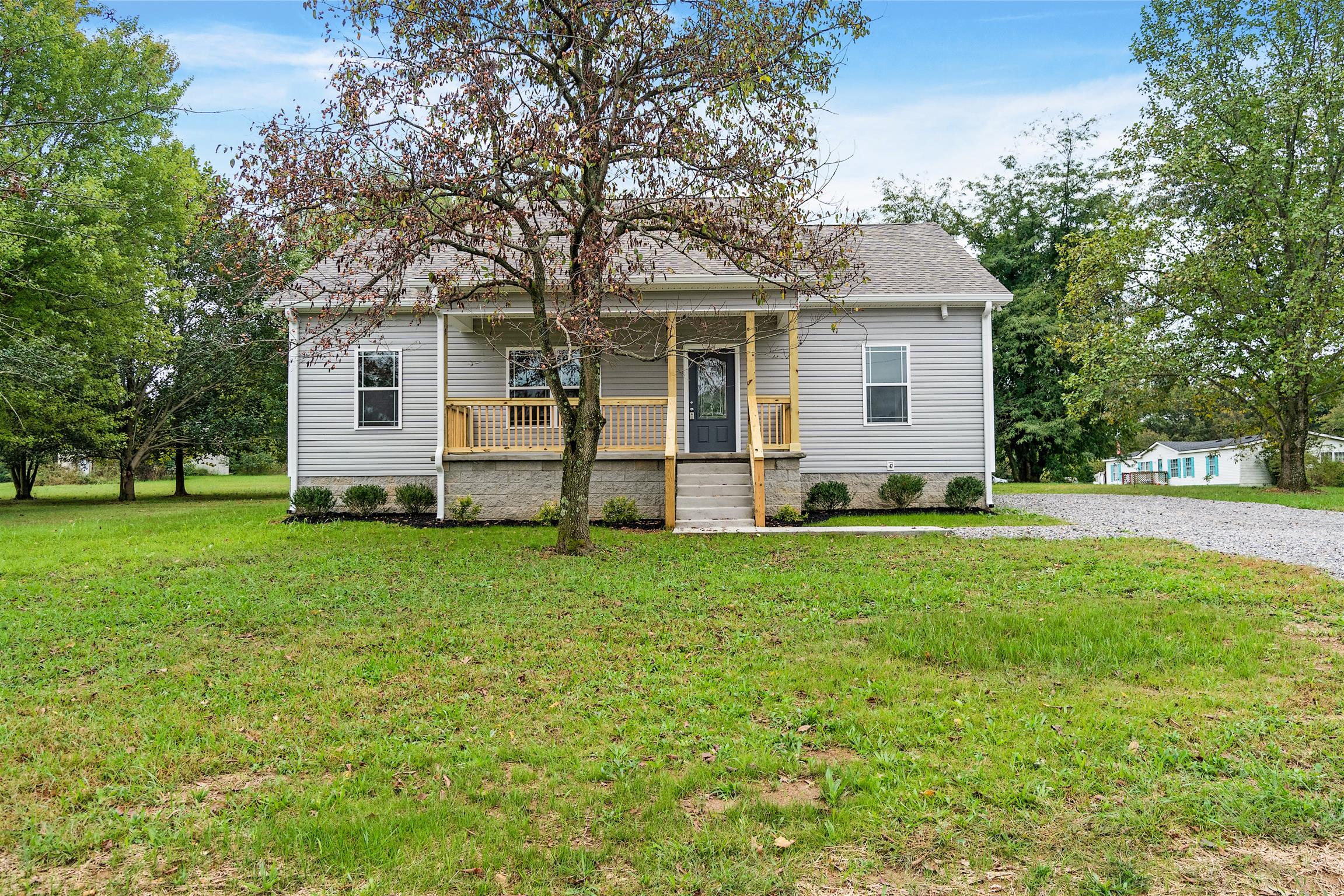 4760 Somerville Road Cross Plains, TN 37049 - Photo 3 of 30 a front view of house with yard and green space