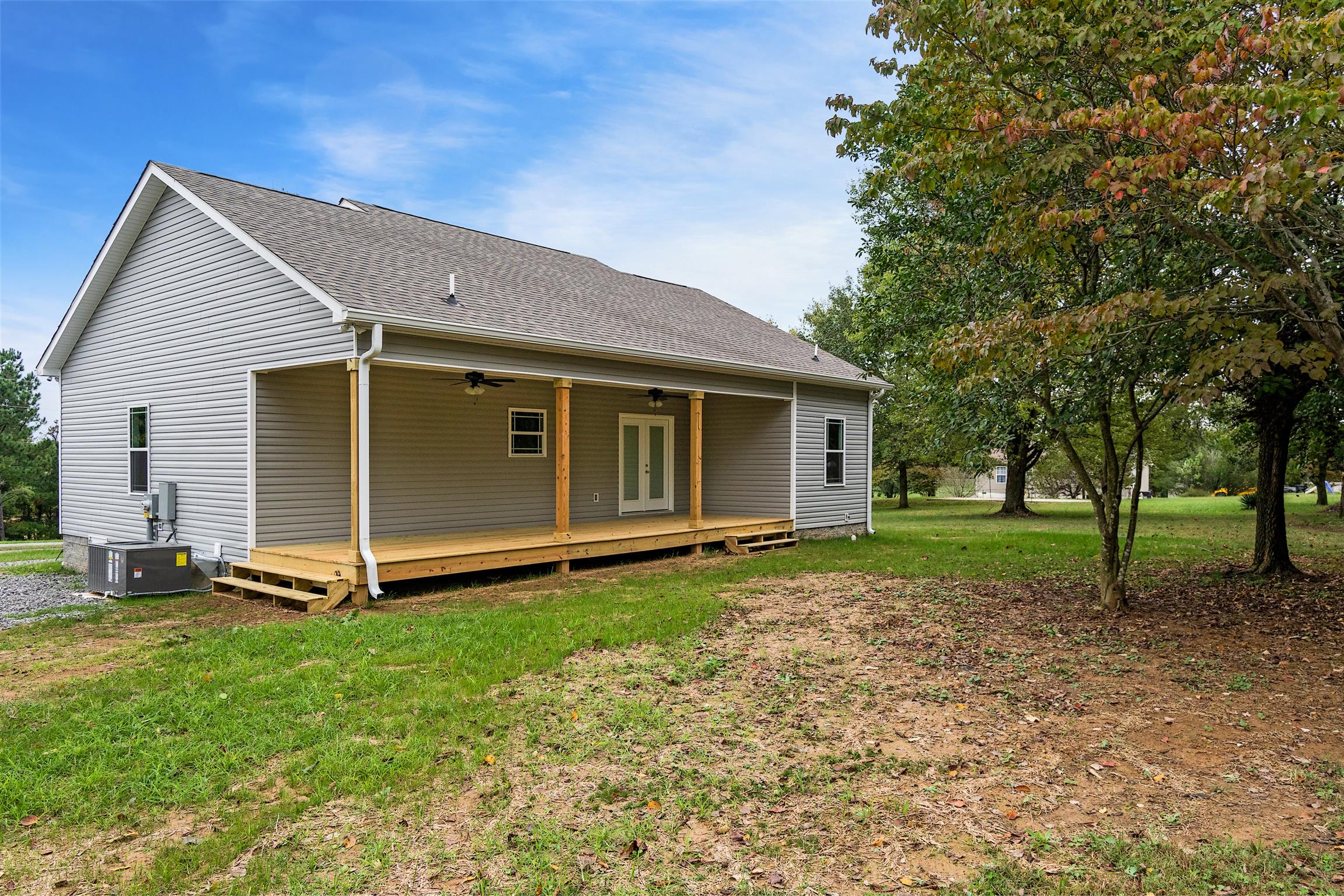 4760 Somerville Road Cross Plains, TN 37049 - Photo 4 of 30 a view of a house with backyard and trees