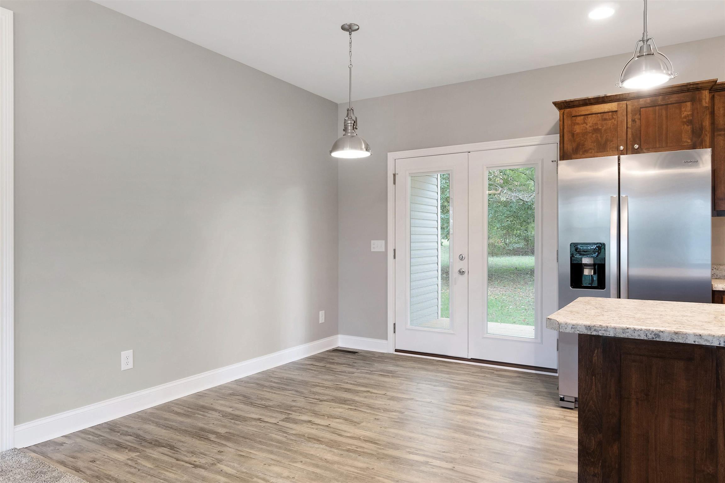 4760 Somerville Road Cross Plains, TN 37049 - Photo 9 of 30 a view of a kitchen with a refrigerator and a window
