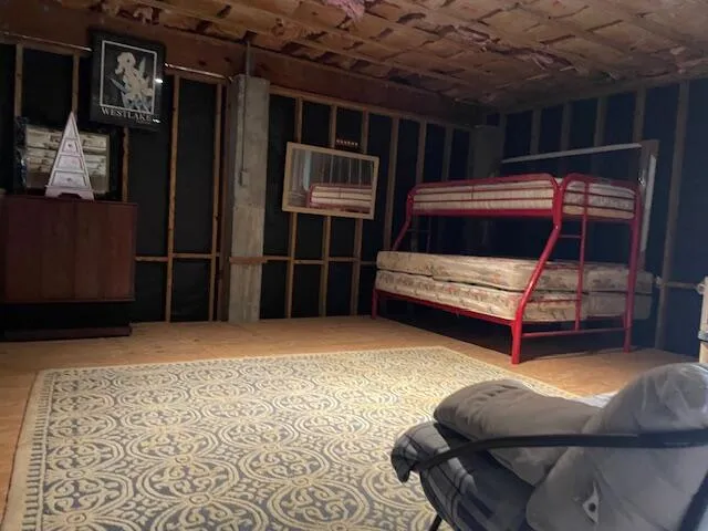 a bedroom with furniture and a window