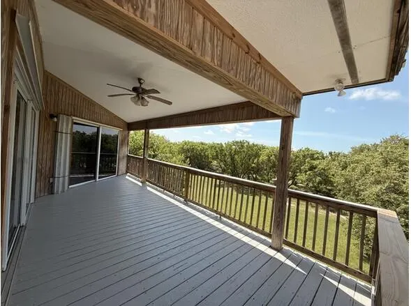 a view of balcony with wooden floor